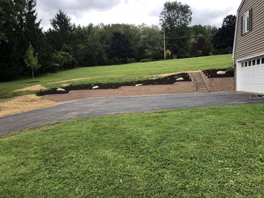 Landscape Retaining wall and steps with fresh landscaping