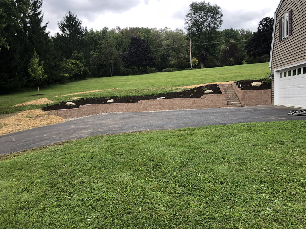 Landscape Retaining wall Landscape Retaining wall and steps with fresh landscaping